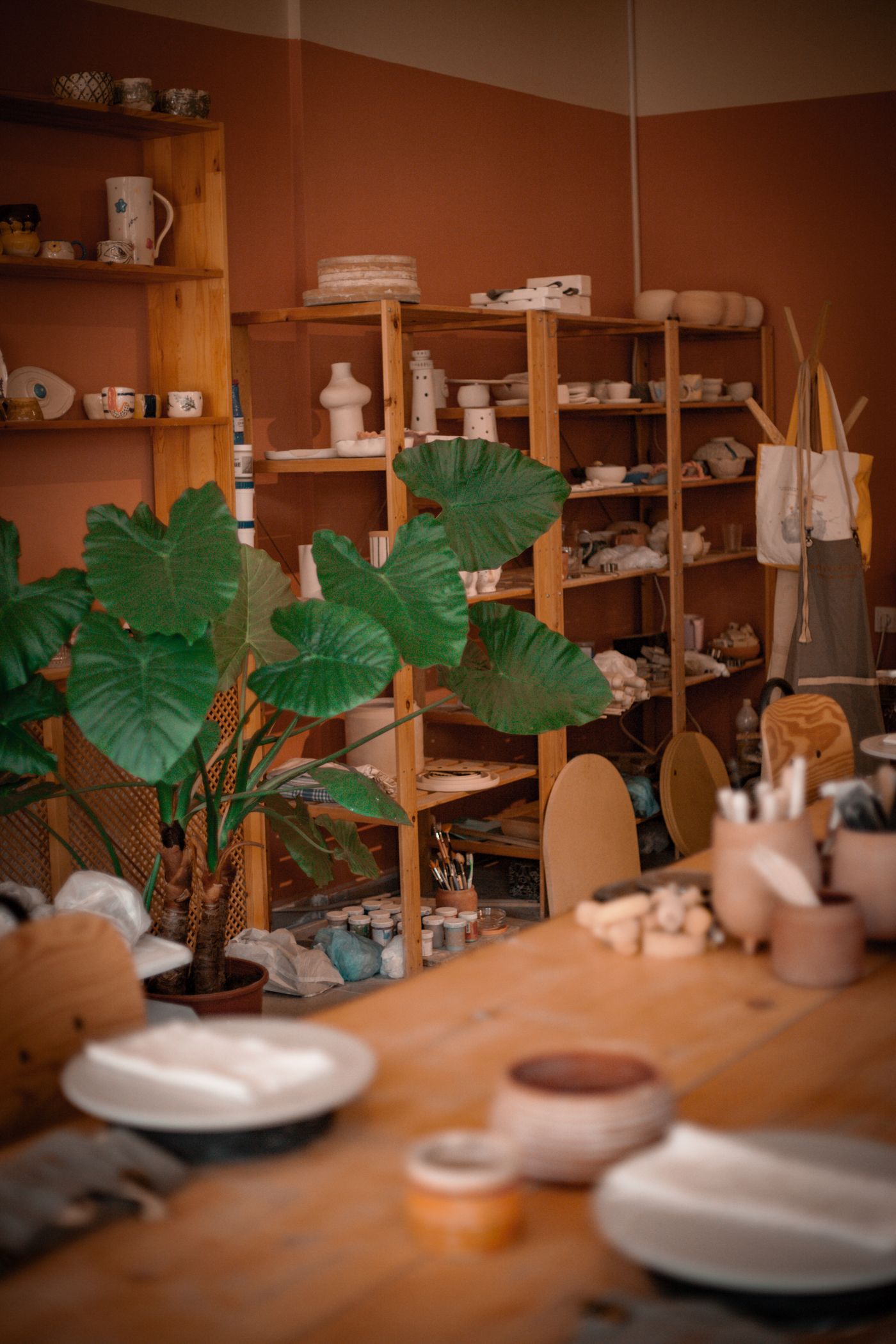 A warm ceramics studio filled with handmade pottery