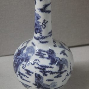 Decorative Chinese porcelain vase photographed on a plain background.