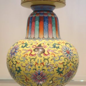 Jingdezhen glazed porcelain vase decorated with painted enamel detailing.