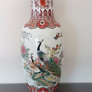 Porcelain vase hand-painted with colorful peacocks and floral motifs.